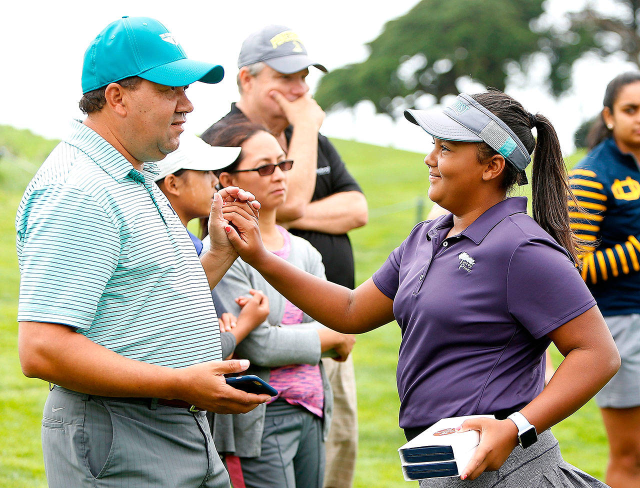 Kasey Maralack celebrates with her father, David, after winning the Overall girls 12-13 years division of the Drive, Chip and Putt Western Region qualifying tournament at The Olympic Club on Sept. 9, in Daly City, California. (Photo by Lachlan Cunningham/Getty Images for DC&P Championship)