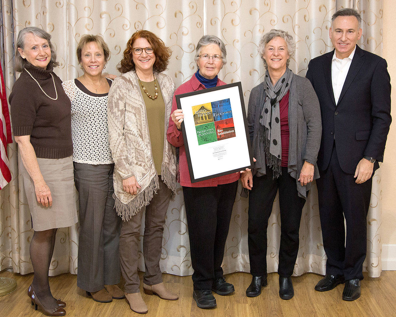 Recognized for their work in educating the public about Fall City’s history, the Fall City Historical Society’s board, from left, Donna Driver-Kummen, Paula Spence, Anne Neilson, Ruth Pickering and Cindy Parks accept the Spellman award from King County Executive Dow Constantine. Leanne Adcox, not pictured, is also on the board. (King County photo by Ned Ahrens)