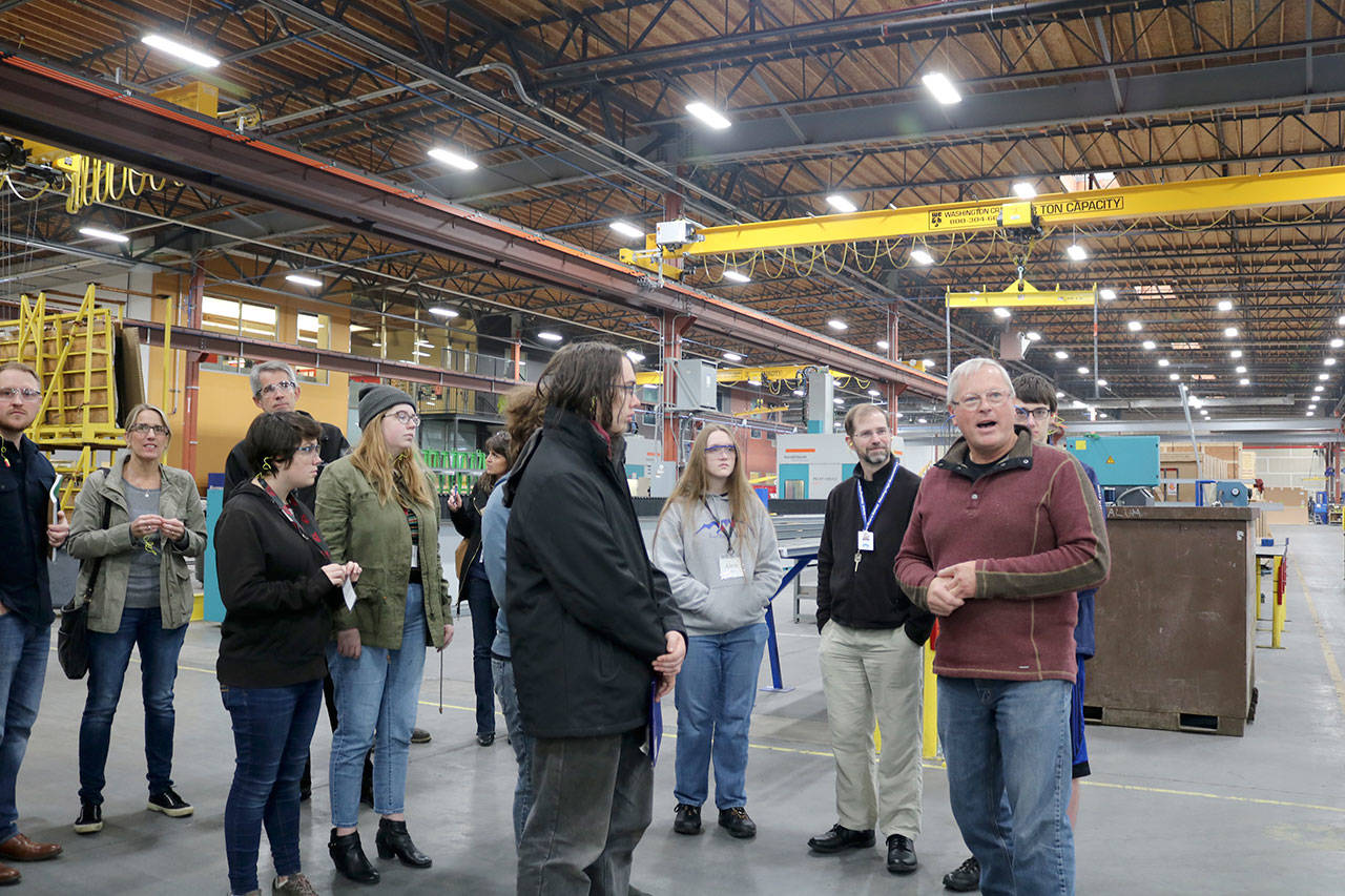 Tim Anderson leads a tour through the Technical Glass Products warehouse. (Evan Pappas/Staff Photo)