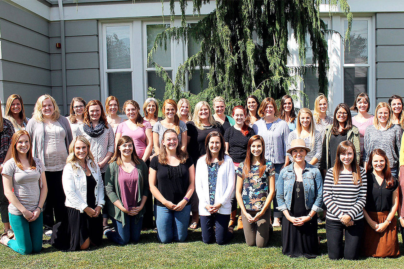 A group of new teachers hired in 2013 pose in front of the Snoqualmie Valley School District Office. (File Photo)