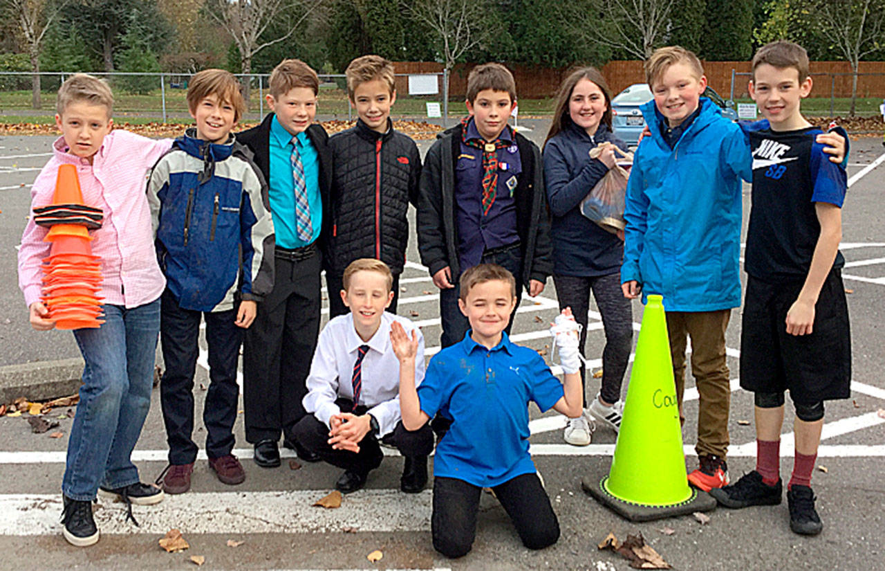 Snoqualmie Elementary School’s VIP parking committee gathered on Nov. 9 to mark designated parking spaces for their guests. (Courtesy Photo)