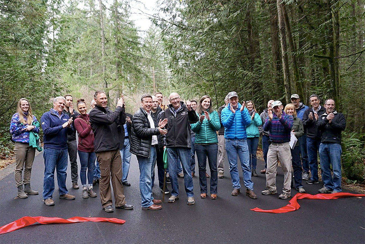 A small crowd joins the celebration of improvements to the High Point Trailhead, including new pavement in the parking lot and improved access for buses. (Courtesy Photo)