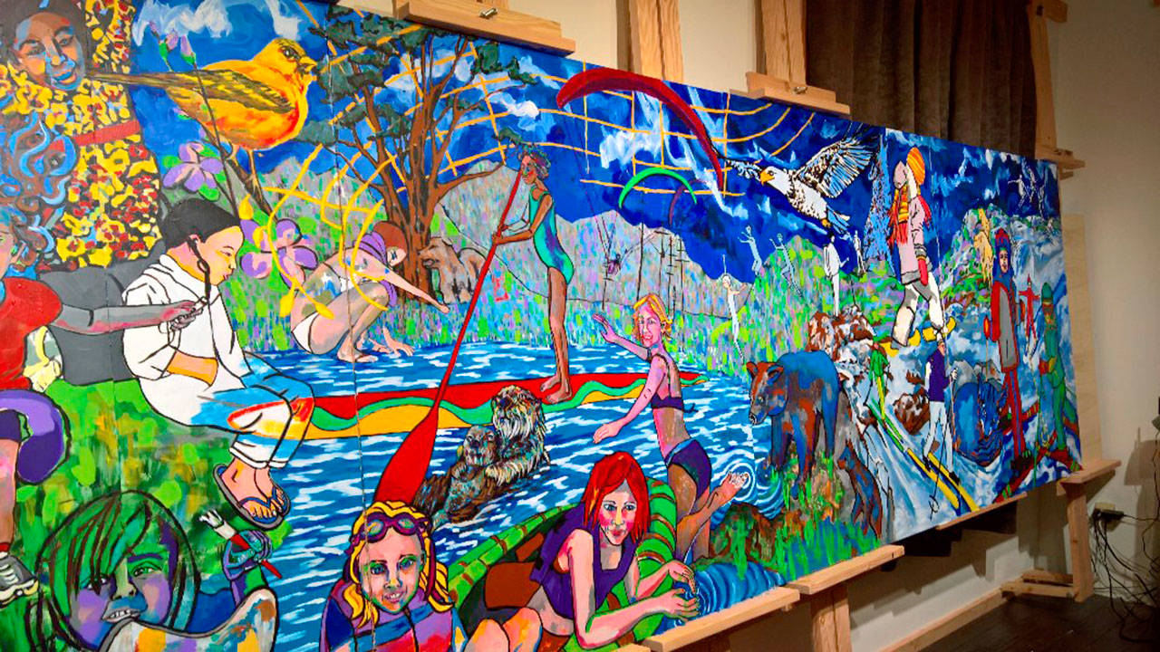 The new mural installed in the Opstad Elementary School gym, pictured here in artist Kristin Lockwood’s studio, depicts outdoor activities and invites students to explore the outdoors. (Courtesy Photo)