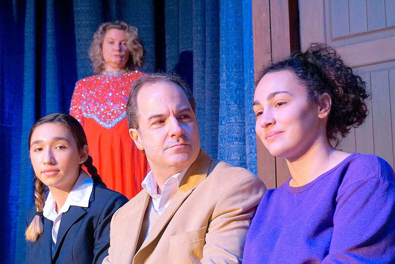 Jake, played by René Schuchter, center, talks with both versions of his daughter, Molly, at age 12, played by Bella Branson, left, and at age 21, played by Rachel Friedley, right, while his sister Karen, played by Brynne Garman, back, watches. (Courtesy Photo)