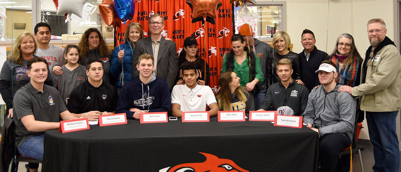 Family members and coaches celebrate with Mount Si High School athletes who committed to playing sports in college at a Wednesday morning ceremony. (Carol Ladwig/Staff Photo)
