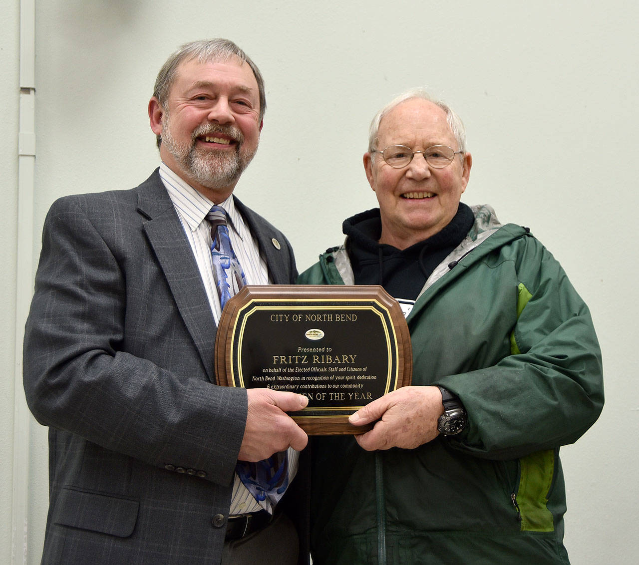 North Bend Mayor Ken Hearing, right, congratulates Fritz Ribary, who has been named the 2018 North Bend Citizen of the Year. (Carol Ladwig/Staff Photo)