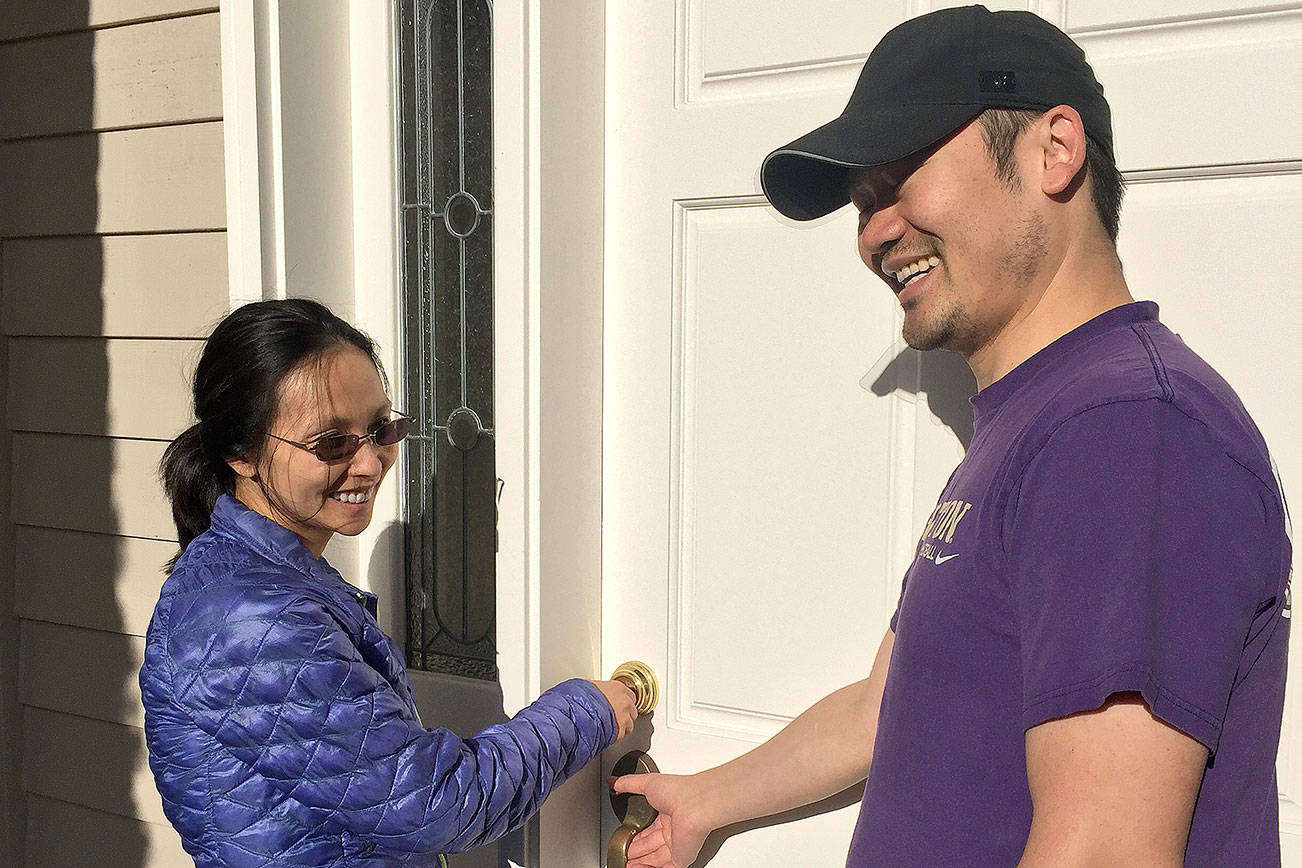 Chloe and Daniel Lis open the door to their first home, after a whirlwind journey in the real estate market. (Courtesy Photo)