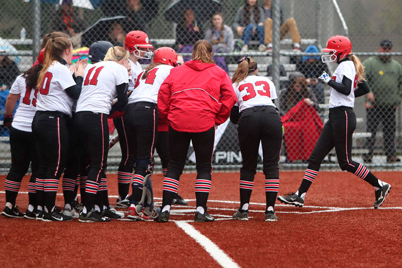 Photo courtesy of Don Borin/Stop Action Photography                                Mount Si Wildcats players surround Sam Simmons after she connected on a home run to left field in the top of the fifth inning. Mount Si defeated Issaquah, 6-4, on April 5.