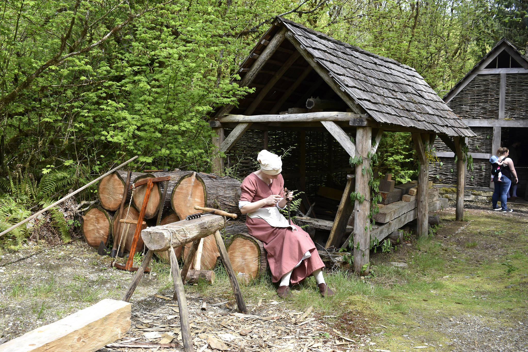 A timber framer’s wife works on a project at Camlann Medieval Village. Raechel Dawson/staff photo