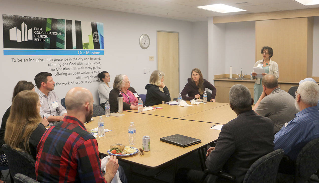 A small group discusses how domestic violence can lead women to homelessness. Evan Pappas/Staff Photo