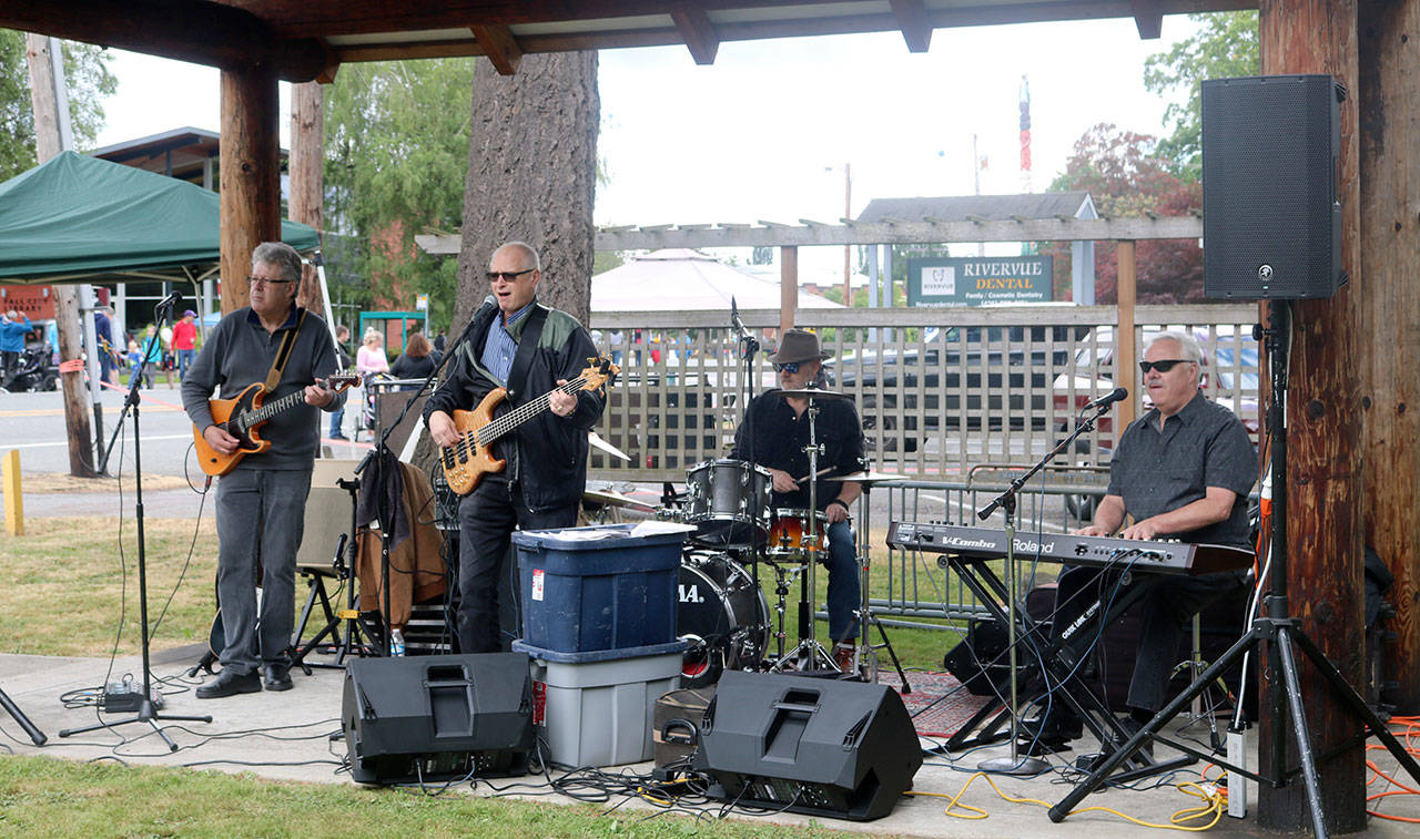 The Rangers, a local band, draws a crowd during their live performance at Quigley Park. Evan Pappas/Staff Photo
