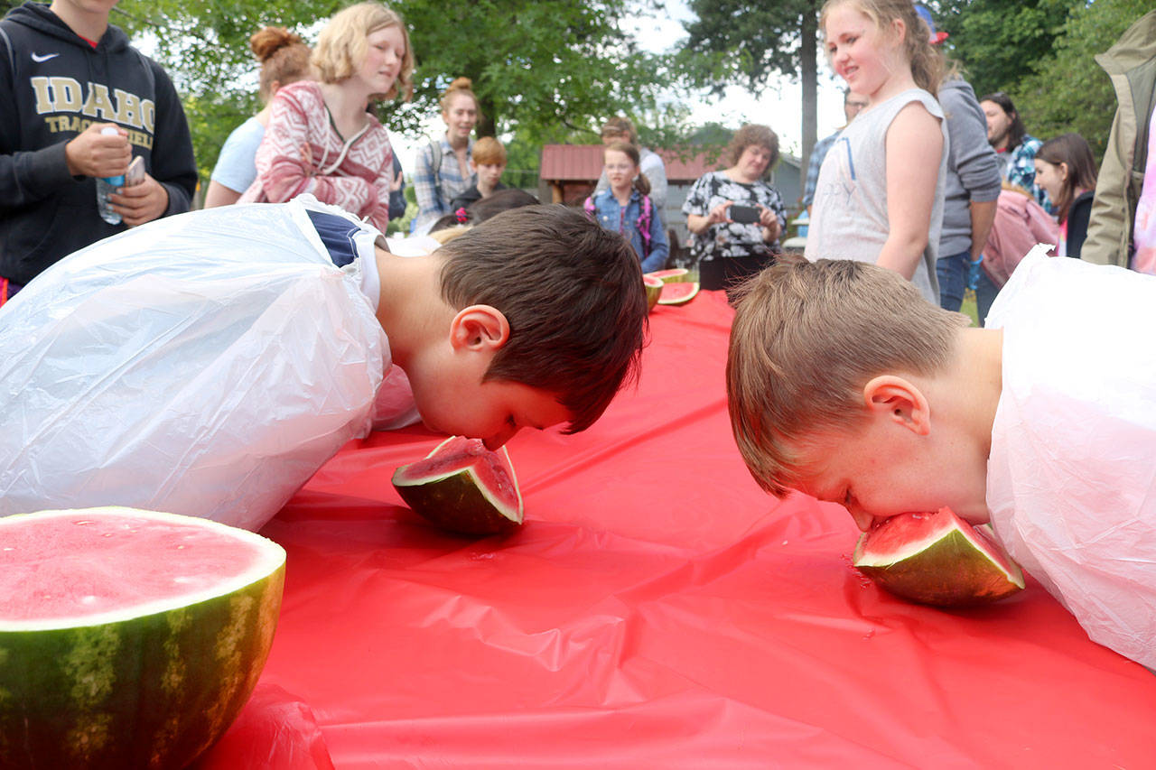 The watermelon eating contest draws a huge crowd as kids of all ages try their best to win. Evan Pappas/Staff Photo