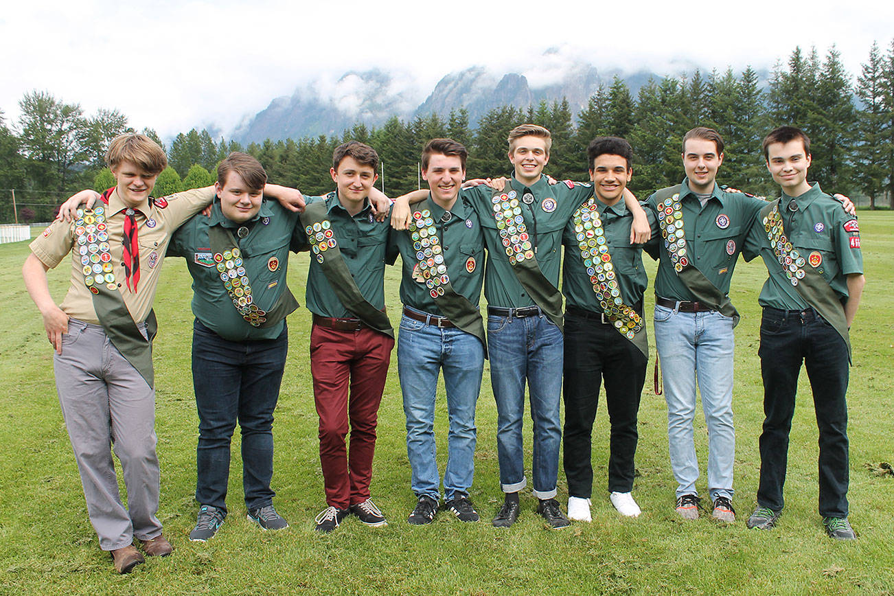 The eight scouts pose with their accumulative badges after earning their Eagle Scout ranks. Photo courtesy of Troop 466