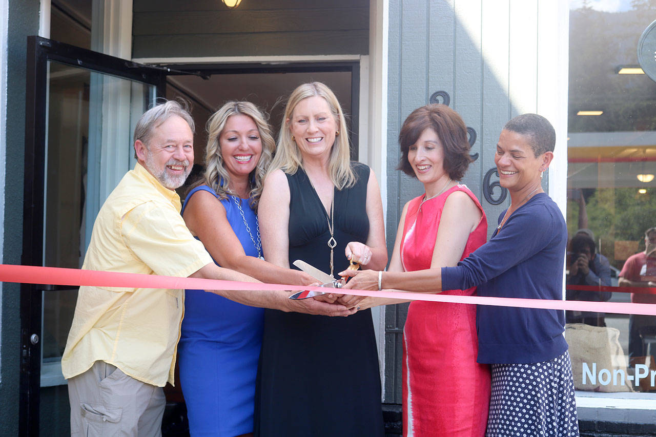 Representatives from North Bend and King County help The Trail Youth cut the ribbon on the official grand opening of the coffee house. From left: North Bend Mayor Ken Hearing, Tonya Guinn, Wendy Laxton, Kristin Zuray, and King County Best Starts for Kids Strategic Advisor Sheila Capestany. Evan Pappas/Staff Photo