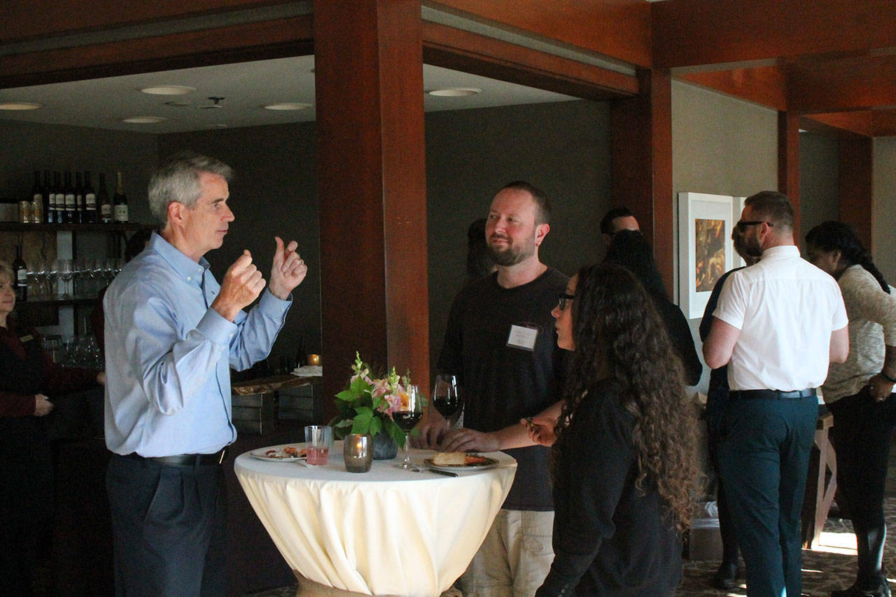 Snoqualmie mayor Matt Larson talks with other guests at the Salish Lodge and Spa grand reopening. The lodge underwent a $13 million remodel which was recently finished. Aaron Kunkler/Staff photo