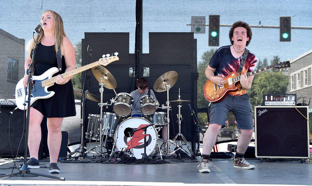 LocoMotive played the Bendigo Stage Saturday at the Block Party. Pictured from left are Bella Mariani, Ethan Horn and Ryan Horn. Carol Ladwig/Staff Photo