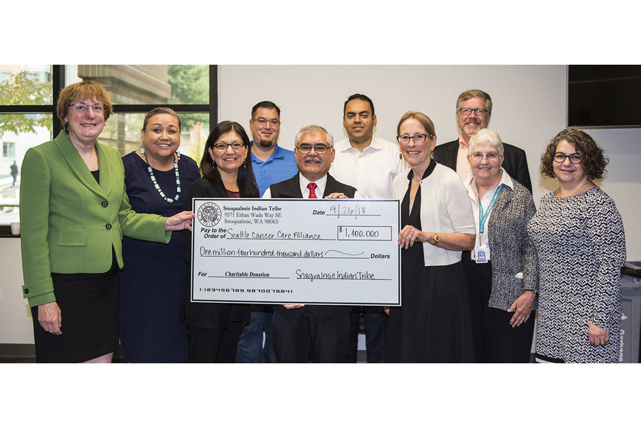 Elected members of the Snoqualmie Tribal Council meet with leaders from the Seattle Cancer Care Alliance to present a check for $1.4 million. From left Dr. Nancy Davidson, executive director and president SCCA, Suzanne Sailto, Snoqualmie Tribal Council, Jolene Williams, Snoqualmie Tribal secretary, Steve de los Angeles, Snoqualmie Tribal deputy secretary, Bob de los Angeles, Snoqualmie Tribal chairman, Michael Ross, Snoqualmie Tribal vice chair, Kari Glover, chair SCCA Board of Directors, Norm Hubbard, executive vice president SCCA, Linda Mattox, chair SCCA Board of Directors Development Committee, Dr. Terry McDonnell, vice president of clinical operations and chief nurse executive SCCA. Photo courtesy of the Snoqualmie Tribe.