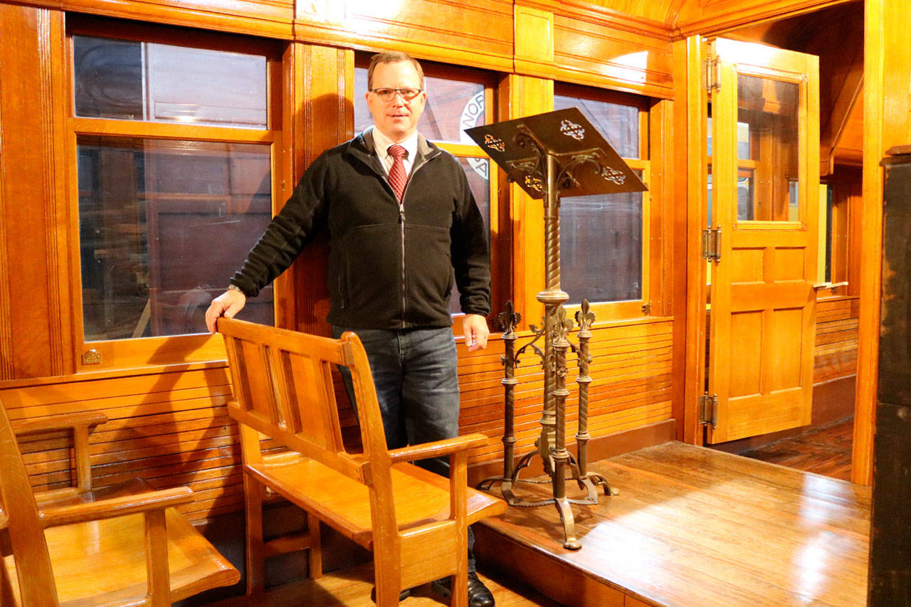 Executive Director Richard Anderson stands inside Chapel Car 5 next to the newly installed pews and the replaced lectern. Evan Pappas/Staff Photo
