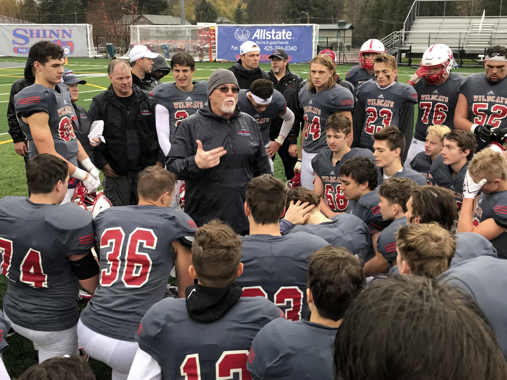 Mount Si Wildcats head football coach Charlie Kinnune, center, addresses his players following their convincing 42-0 victory against the Rogers Rams in a winner-to-state, loser-out playoff game on Nov. 3 in Snoqualmie. Shaun Scott/staff photo