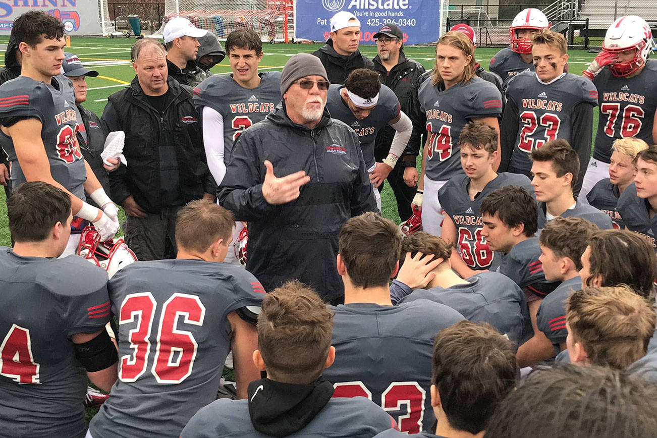 Mount Si Wildcats head football coach Charlie Kinnune, center, addresses his players following their convincing 42-0 victory against the Rogers Rams in a winner-to-state, loser-out playoff game on Nov. 3 in Snoqualmie. Shaun Scott/staff photo