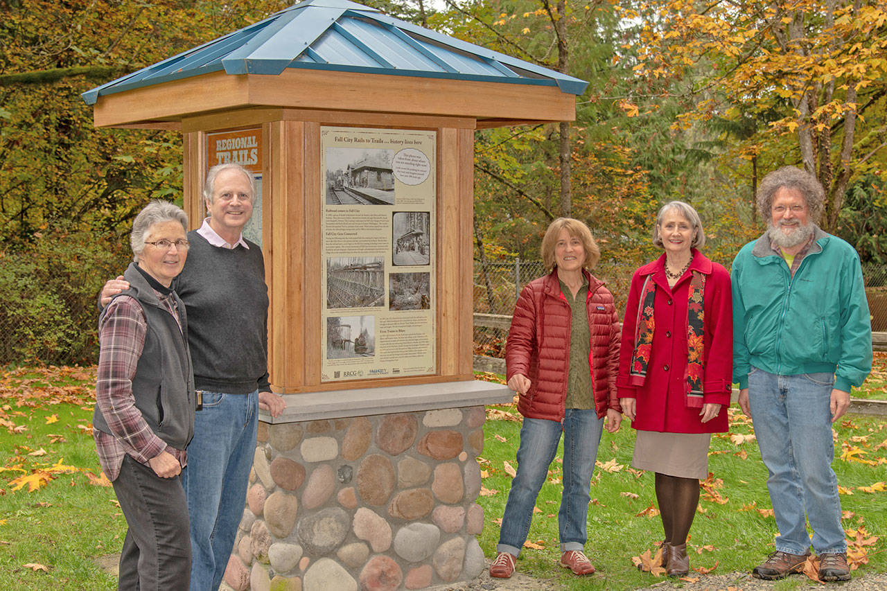 Ed Hazen, Sue Holbink, and Mike Butine of Raging River Conservation Group and Ruth Pickering and Donna Driver-Kummen of Fall City Historical gathered to celebrate the sign installation. Photo by Scott Massey.