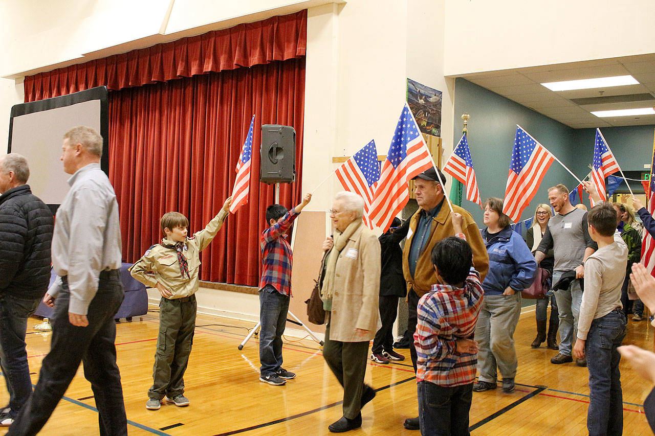 Peter Gabryjelski and other fourth-grade students from Ms. Cuddihys class welcome veterans as they enter the Snoqualmie Elementary Veterans Day assembly on Nov. 9. Madison Miller/staff photo