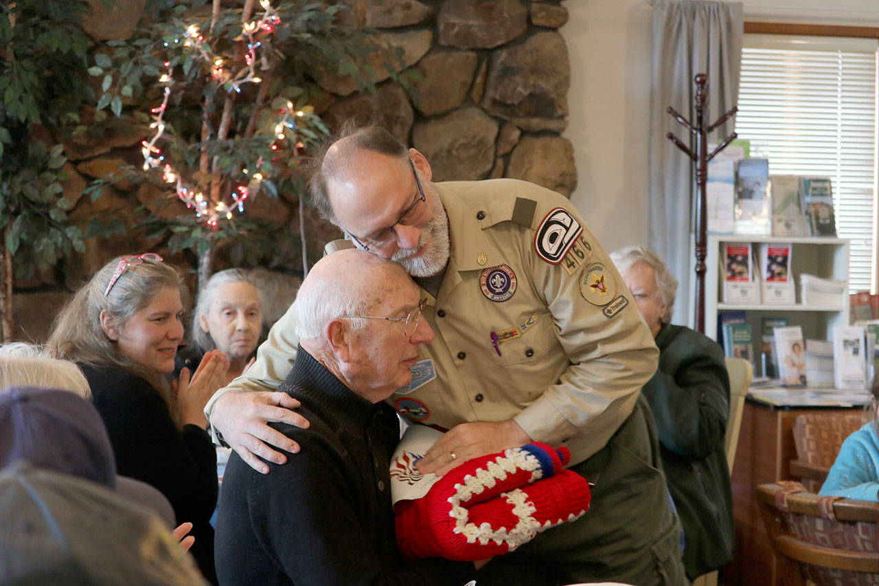 Berry Rogers gave the raffle prize he won to fellow veteran and a personal influence, Harley Brumbaugh. More photos on Page 3. Evan Pappas/Staff Photo