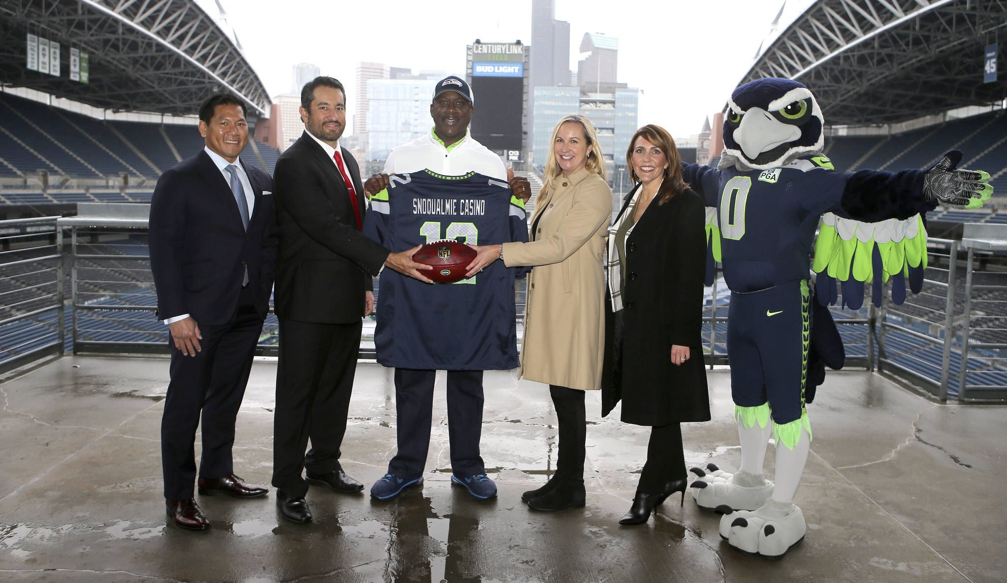 Snoqualmie Casino and the Seattle Seahawks officially form advertising partnership. From left: Casino chief marketing officer Stanford Le, Casino CEO Brian Decorah, former Seahawks player Randall Morris, Seahawks senior VP of revenue Amy Sprangers, and director of sales and corporate partnerships Gina Martinez Todd. Courtesy Photo