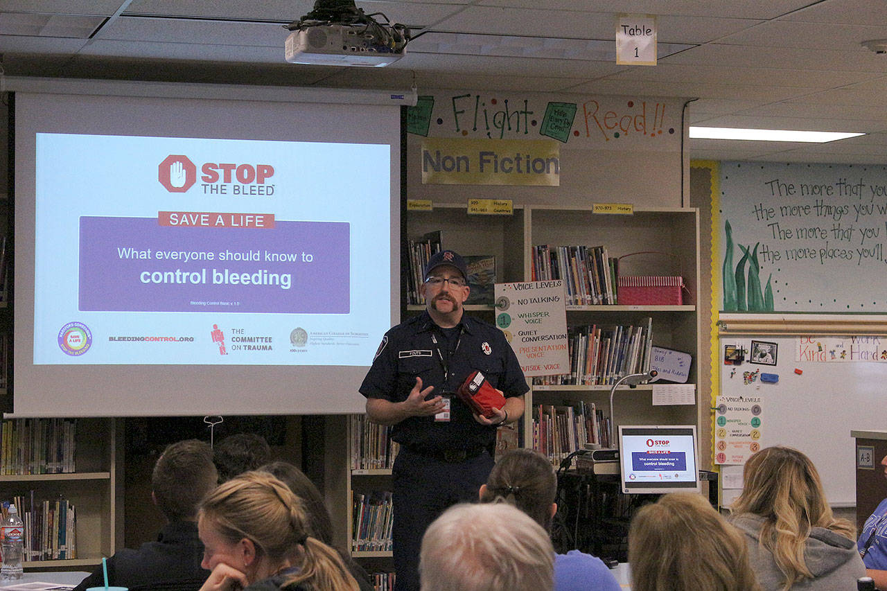 Snoqualmie Fire Dept. Lt. Jake Fouts introduces the Stop the Bleed training to teachers and staff at Opstad Elementary School in North Bend. Madison Miller/staff photo.