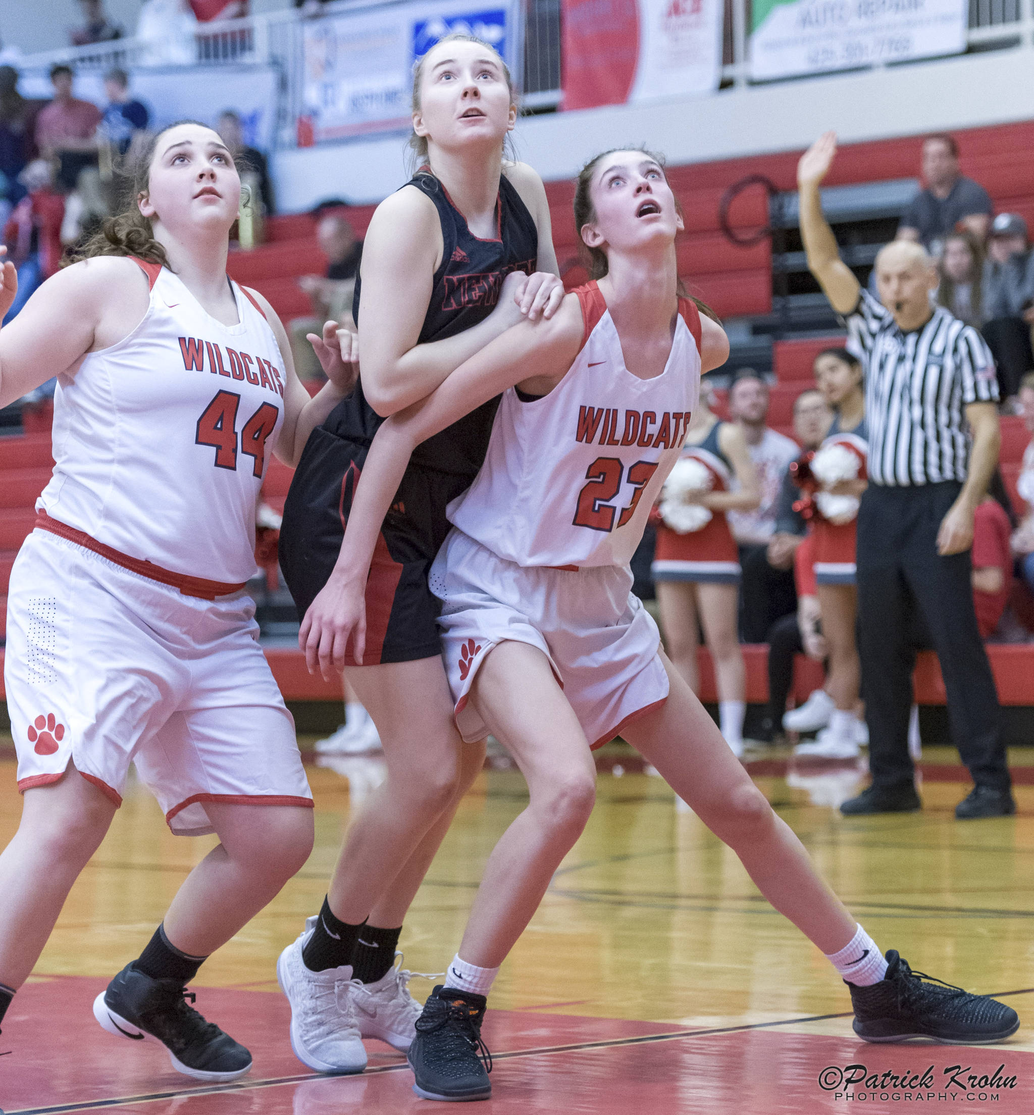 Mount Si Wildcats freshman Lauren Glazier, right, and senior Abigail Triou, left, box out a Newport player during a matchup on senior night on Jan. 16 in Snoqualmie. Photo courtesy of Patrick Krohn/Patrick Krohn Photography