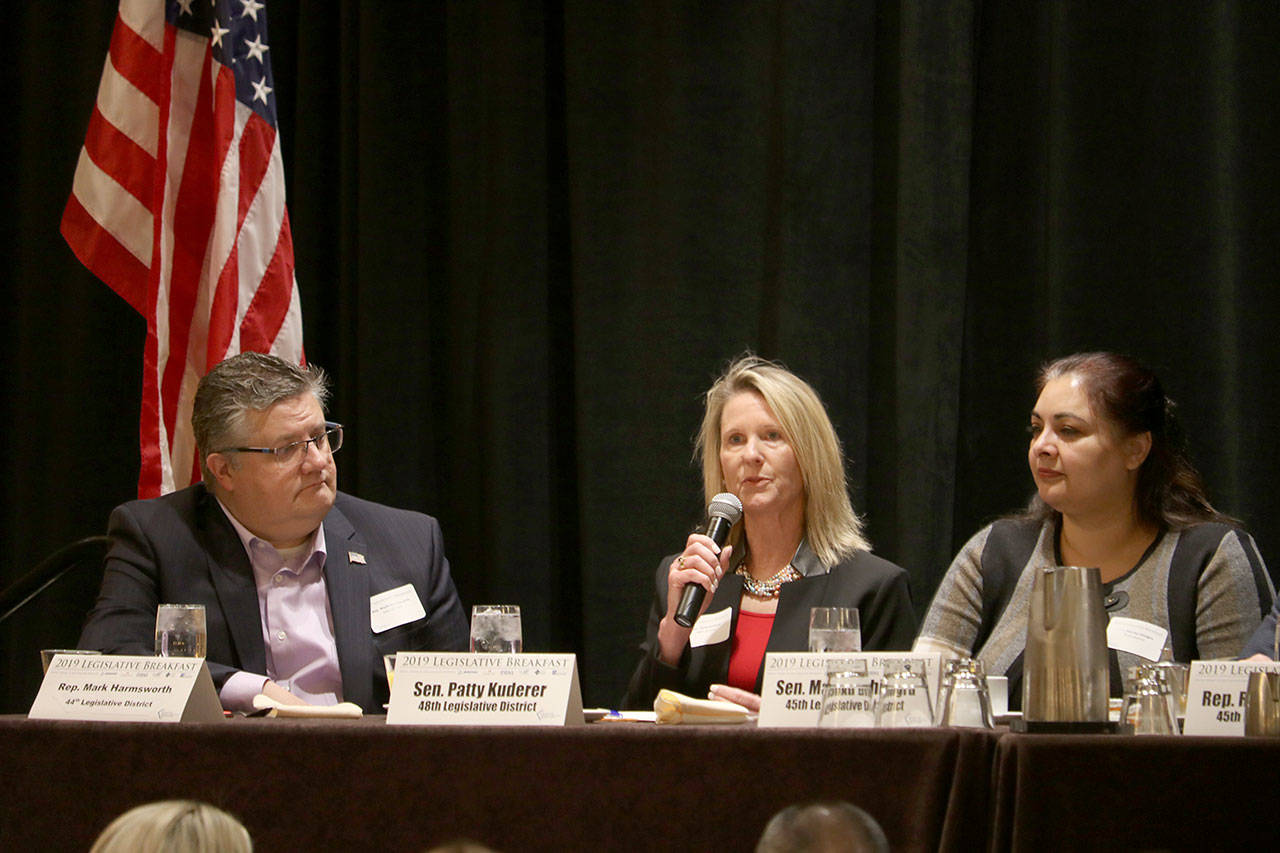 Sen. Patty Kuderer discusses her 2019 plan to work on housing sustainability and affordability at the East King County Chamber Coalition Legislative Breakfast. From left: Rep. Mark Harmsworth, Sen. Patty Kuderer, Sen. Manka Dhingra. Evan Pappas/Staff Photo