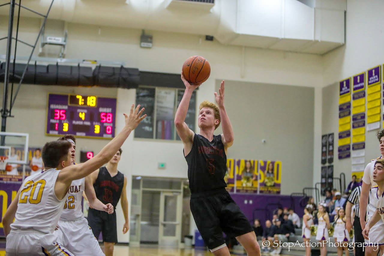 Mount Si Wildcats junior guard Jabe Mullins takes the ball to the hoop in the fourth quarter against the Issaquah Eagles. Mount Si defeated Issaquah 74-49 on Jan. 25 at Issaquah High School. Photo courtesy of Don Borin/Stop Action Photography