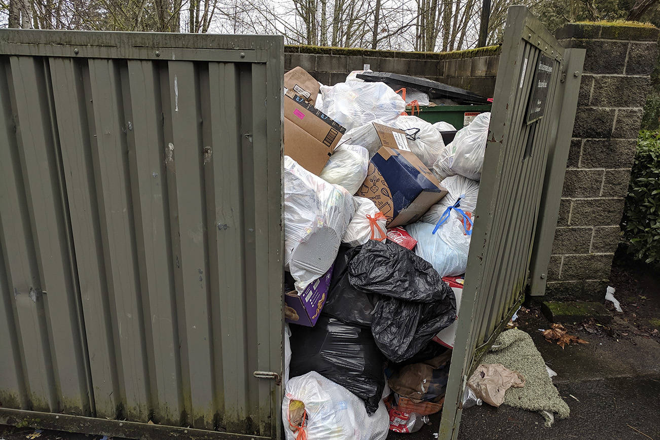 The trash situation at a Redmond apartment complex remained overflowing in the afternoon on Tuesday, Feb. 19, after a series of snowstorms hit the region in February. Corey Morris/staff photo