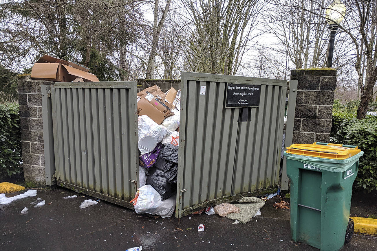 The trash situation at a Redmond apartment complex remained overflowing in the afternoon on Tuesday, Feb. 19, after a series of snowstorms hit the region in February. Corey Morris/staff photo