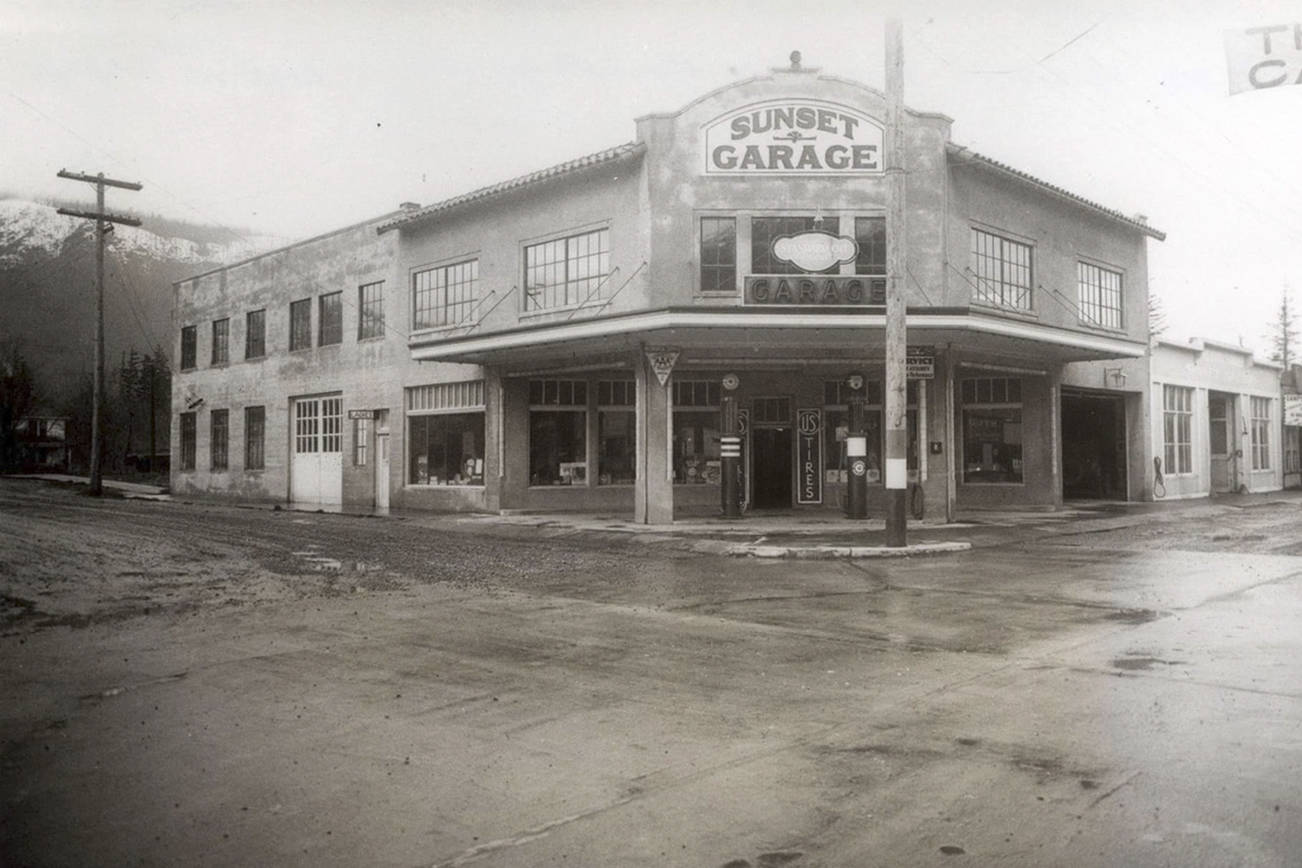Above: A photo of the Sunset Garage in 1937. Below: The Sunset Garage building as it stands in 2019. Work on the restoration will be complete this year. Courtesy photo