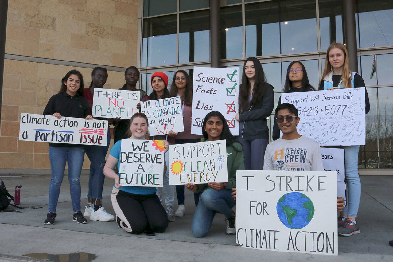 Redmond students gather outside city hall to discuss city environmental policy with the administration. From left, back row: Stephanie Osorio-Tristan, Sara Mou, Ester Girr, Trisha Beher, Bharathi Vaidhyanathan, Faye Thijssen, Sawako Tsukada, and Phoebe Jenkins. From left, front row: Evelyn Briggs, Meghna Shankar, and Arpit Ranasaria. Evan Pappas/Staff Photo