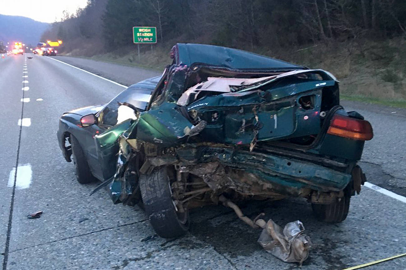 One dead after bus collides into disabled vehicle on I-90
