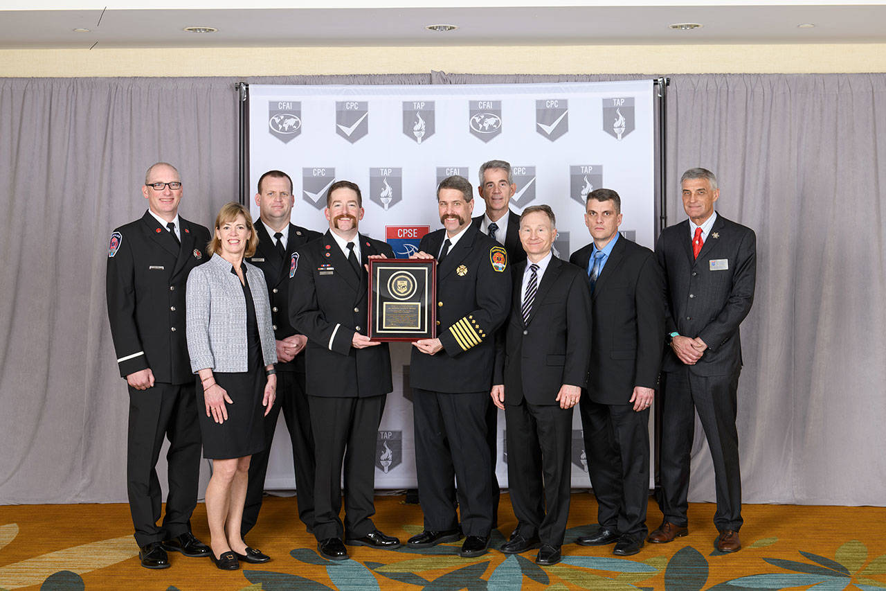 The Snoqualmie Fire Department has become an accredited agency with the Commission on Fire Accreditation International. From left: Snoqualmie: Fire Lt. Matt West, Council Member Katherine Ross, Deputy Chief Mike Bailey, Captain Jake Fouts (Accreditation Manager), Fire Chief Mark Correira, Mayor Matt Larson, City Administrator Bob Larson. CFAI: Will Gray (Peer Team Lead, Pueblo, Colorado Fire), Calgary Fire Chief Steve Dongsworth (CFAI Commission Chair). Courtesy Photo