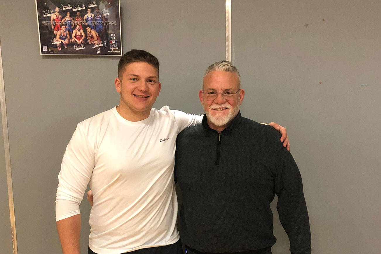 Mount Si Wildcats senior Slater Macko, left, and Mount Si Wildcats head football coach Charlie Kinnune, right, pose for a quick picture in 2019. Macko will compete in the Washington State Coaches Association all-state game this July. Photo courtesy of Charlie Kinnune