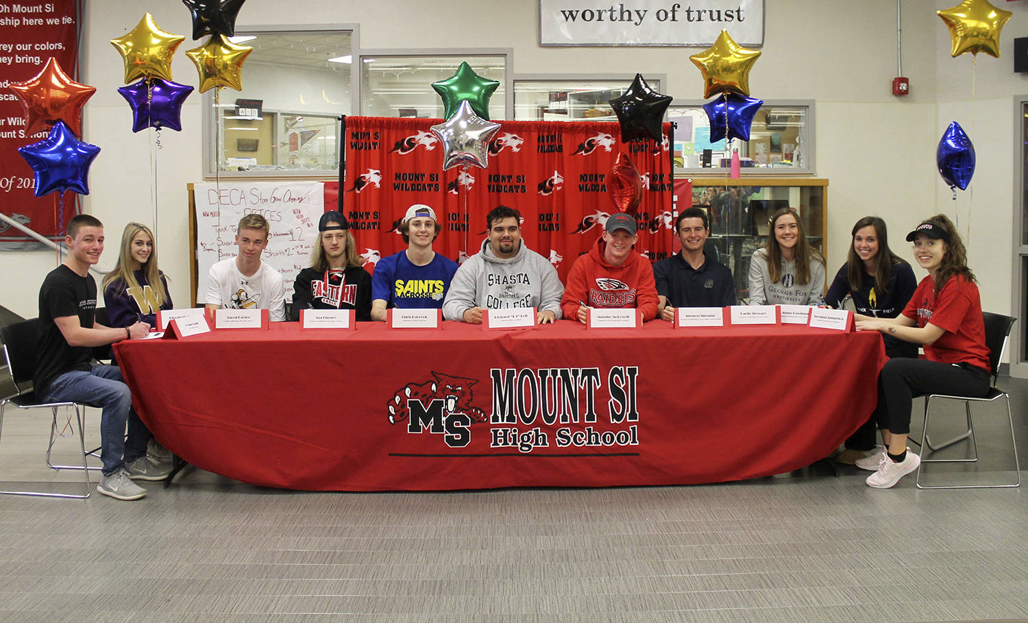 Eleven Mount Si Wildcats athletes announced where they would be competing in collegiate athletics next year during a signing-day ceremony on May 1 at Mount Si High School. Photo courtesy of Carolyn Malcolm