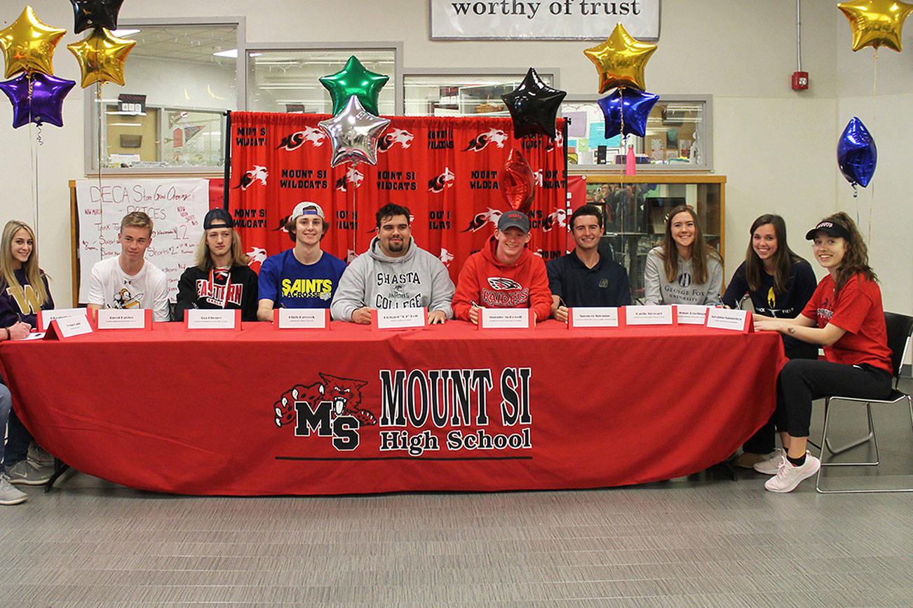 Eleven Mount Si Wildcats athletes announced where they would be competing in collegiate athletics next year during a signing-day ceremony on May 1 at Mount Si High School. Photo courtesy of Carolyn Malcolm