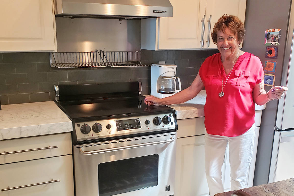 Kay Plimpton is thrilled with the way her new countertops and backsplashes from Granite Transformations of Seattle brightened up her kitchen.