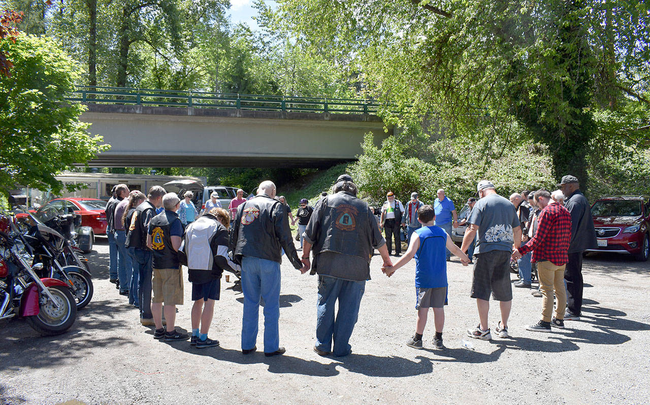 Attendees of the SVMA Biker Dedication link hands in a circle to pray for the safety of the bikers on the road this summer. Dana Beatty/Courtesy Photo