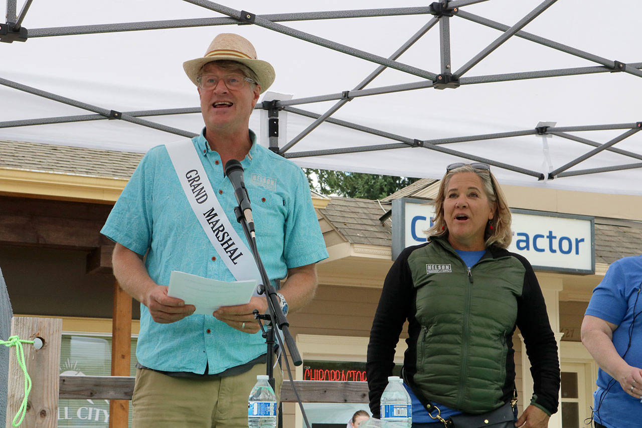 Pete and Judy Nelson, grand marshals of the event, announce the winners of the parade awards. Evan Pappas/Staff Photo