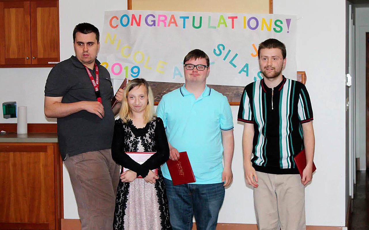 Snoqualmie Valley School District’s Transition Learning Center (TLC) graduated four students: Axel Smith, Nicole Yancey, Silas Palmisano and Jon Isitt. Photo courtesy of SVSD
