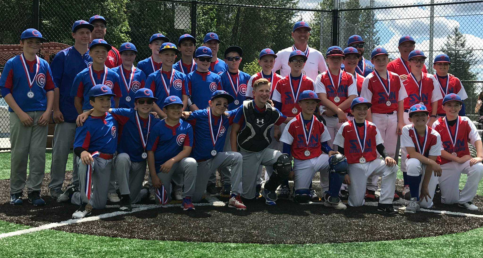 The Snoqualmie Valley North Cubs beat the Falls Cubs, 5-4, in eight innings of the Little League majors Snoqualmie Valley championship game on June 8 at Big Rock Field in Duvall. Both teams are pictured after receiving their medals: first place SVN Cubs in red and second place Falls Cubs in blue. The three Snoqualmie Valley leagues — Falls, Snoqualmie Valley and Snoqualmie Valley North — play against each other in the end-of-the-season playoffs that resulted in the championship game. Courtesy photo