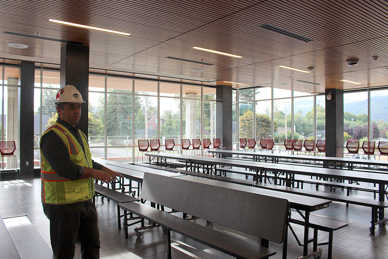 Photo by Madison Miller / staff photo                                SVSD assistant superintendent Ryan Stokes walks through one of the multiple commons areas in the new MSHS.