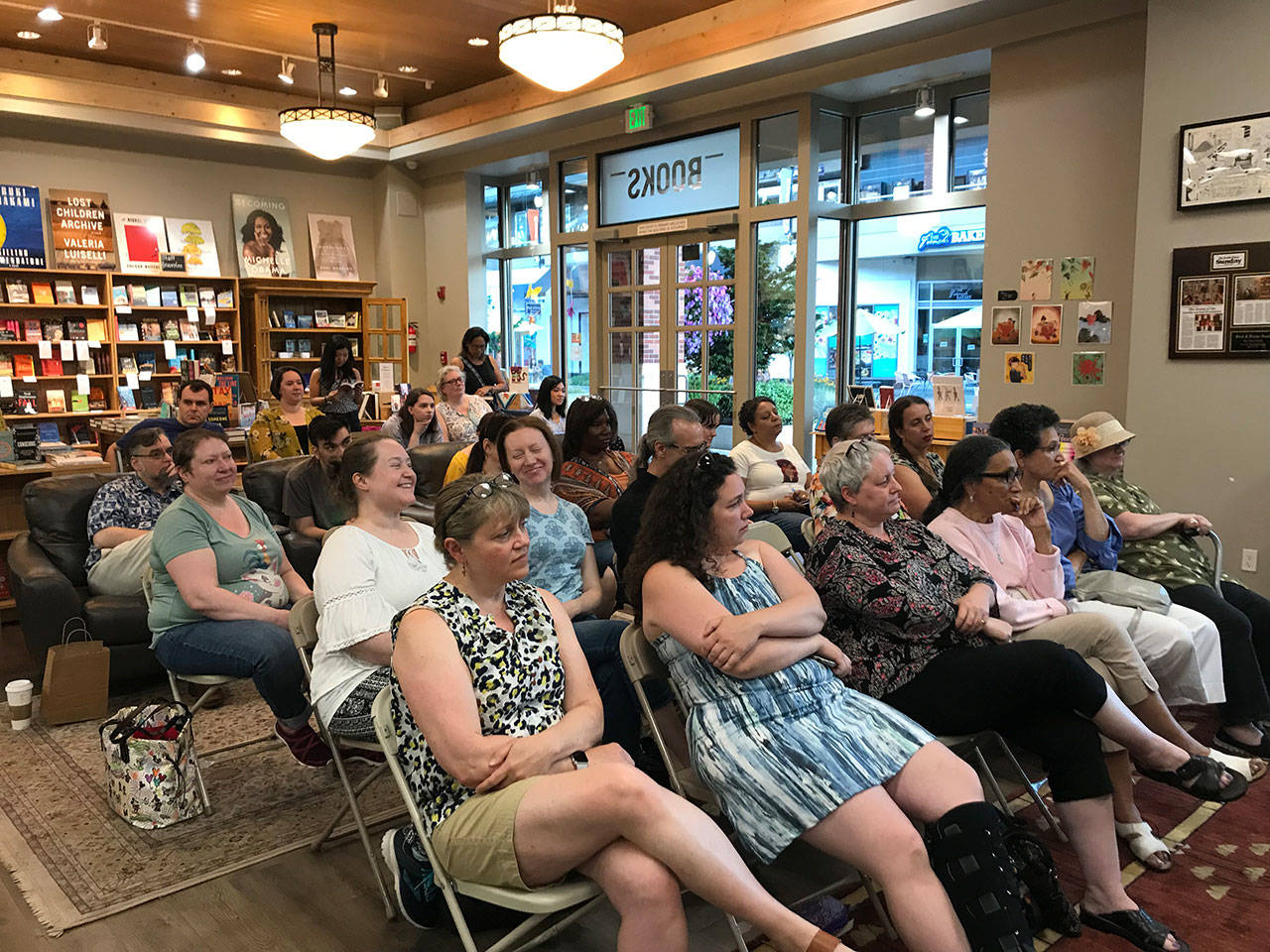 The audience at Brick & Mortar Books in Redmond listens to authors discussing the importance of representation in stories. Samantha Pak/staff photo