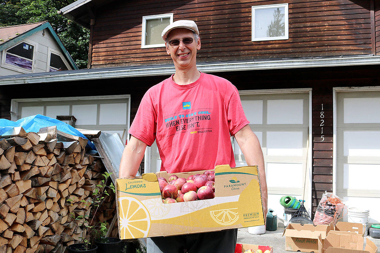 Photos by Stephanie Quiroz/staff photo                                Greg Giuliani outside of his home, ready to press apples for the season.