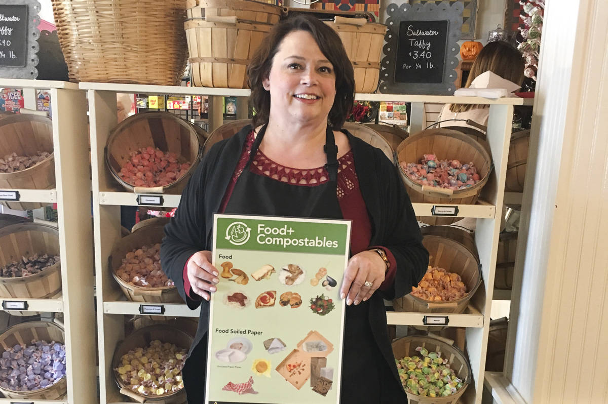 Snoqualmie Falls Candy Shoppe owner Marsha Harris poses after enrolling her business in composting services through a program offered by the City of Snoqualmie and Waste Management. Businesses can join the limited time assistance program through the end of the year. Courtesy photo